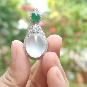 a hand holding a ring