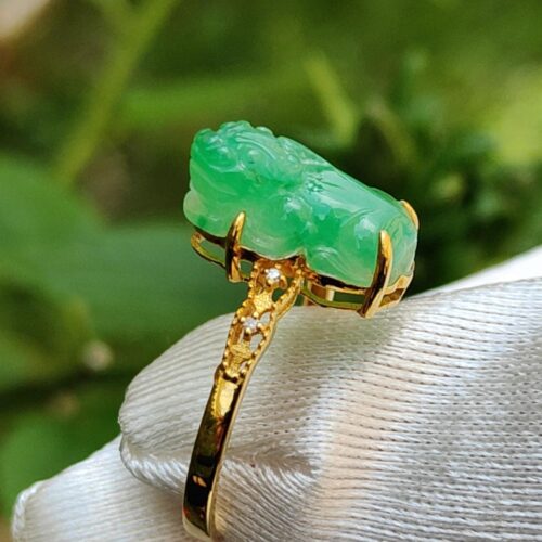 a ring with a jade stone on it