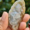 a person holding a stone