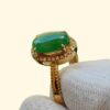 a hand holding a ring