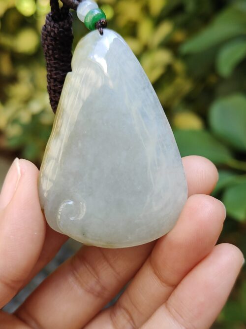 a hand holding a stone