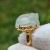 a ring with a jade stone on it