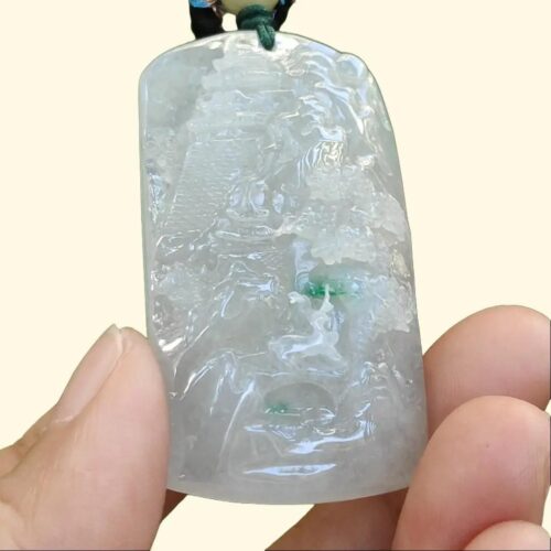 a person holding a small figurine