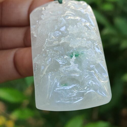 a hand holding a white rectangular object