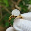 a ring with a white stone in it