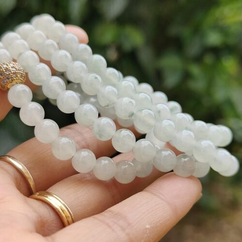 a person holding a necklace