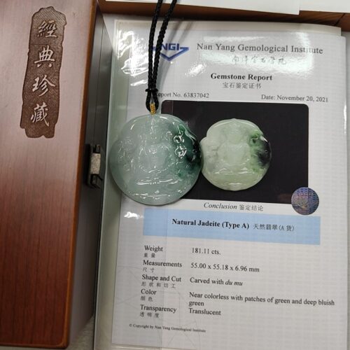 a jade pendant in a box