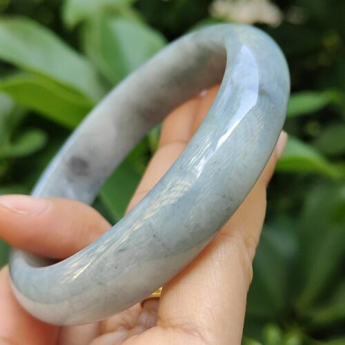 a hand holding a bracelet