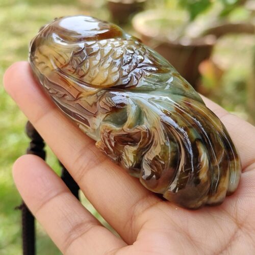 a hand holding a stone