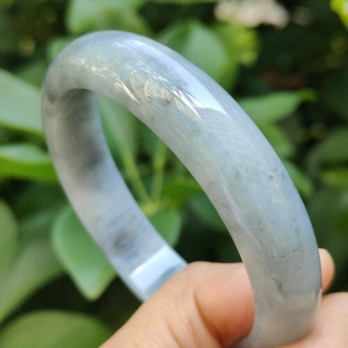 a hand holding a bracelet