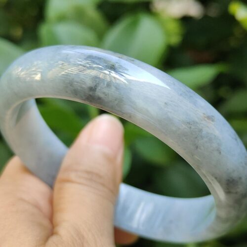 a hand holding a bracelet