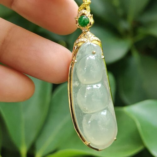 a hand holding a necklace