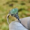 a hand holding a ring