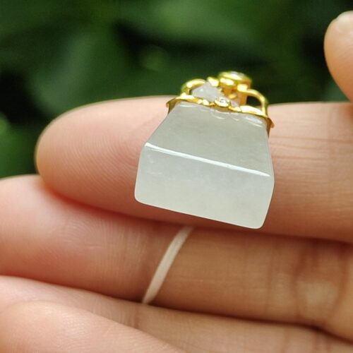 a person holding a small white object