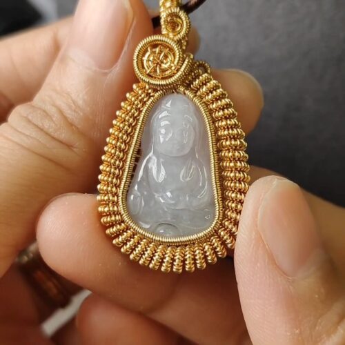 a person holding a necklace