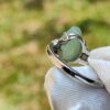 a hand holding a ring