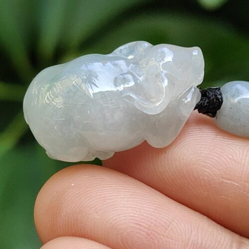 a close up of a hand holding a white object