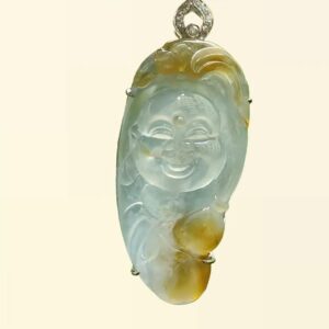 a jade pendant with a smiling face