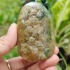 a hand holding a stone