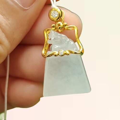 a hand holding a necklace