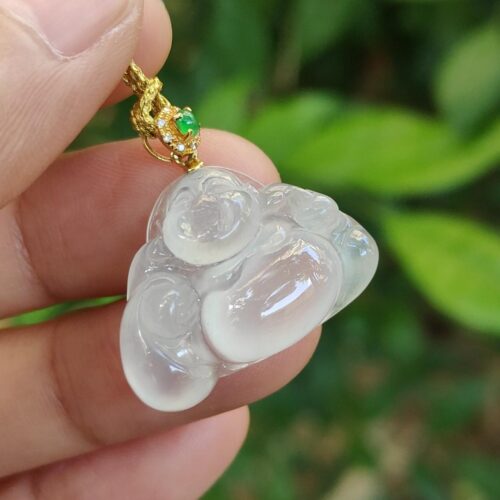 a hand holding a necklace