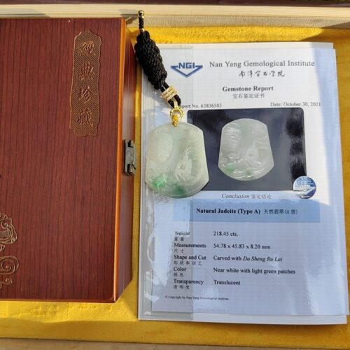 a jade pendant in a box