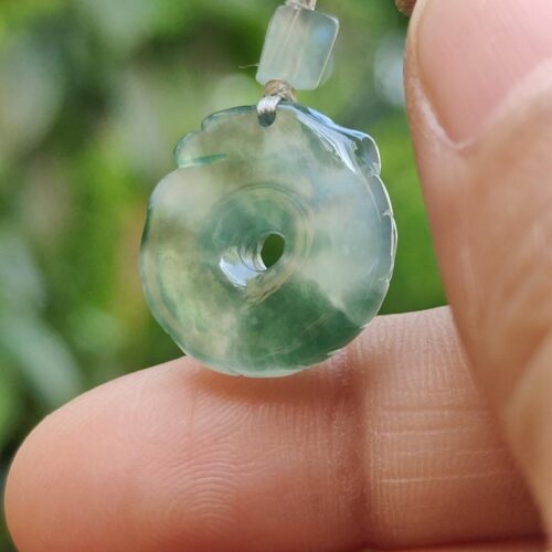 a person holding a necklace