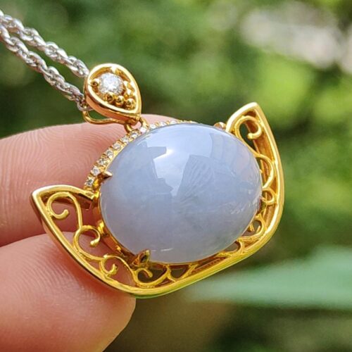 a hand holding a necklace