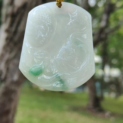 a jade pendant from a tree
