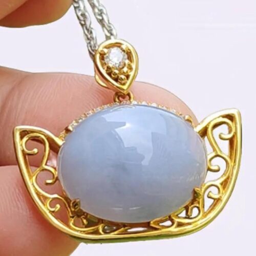 a hand holding a necklace