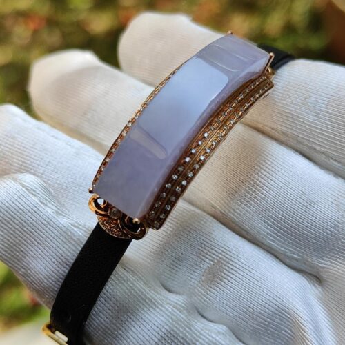 a hand wearing a glove with a bracelet