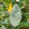 a jade pendant from a string