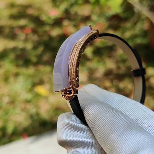 a hand holding a bracelet