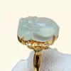 a ring with a jade stone in it