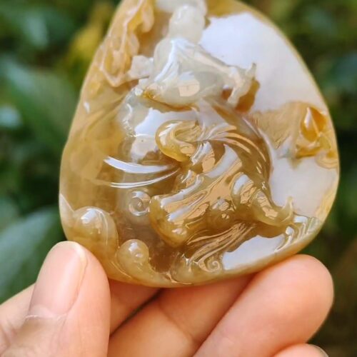a hand holding a stone