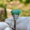 a ring with a jade stone on it