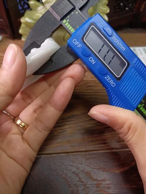 a person holding a blue device