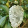 a jade pendant from a tree
