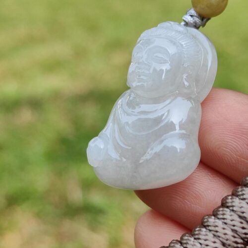 a person holding a jade necklace