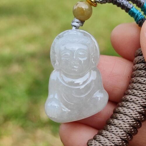a hand holding a bead