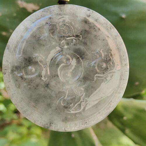 a round stone pendant from a string