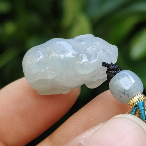 a person holding a bead