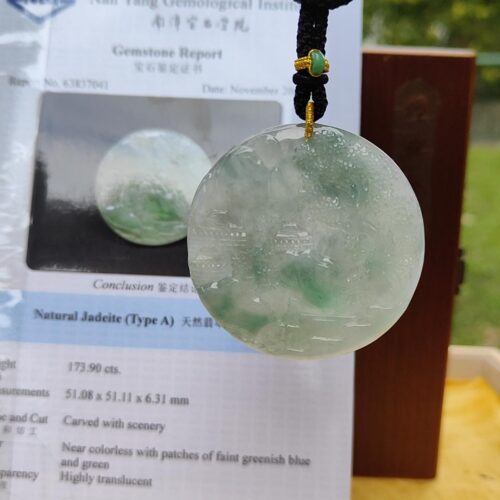 a jade pendant on a string