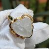 a ring with a gold band and a gold ring with a gold band and a gold band with a white glove