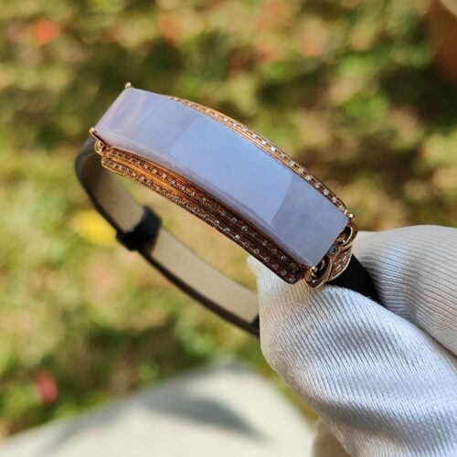 a hand holding a bracelet