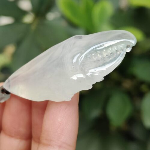 a hand holding a clear object