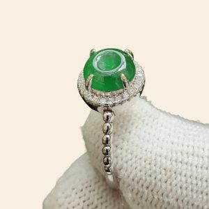 a ring on a white knitted surface