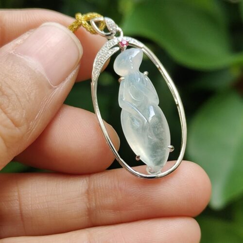 a hand holding a necklace