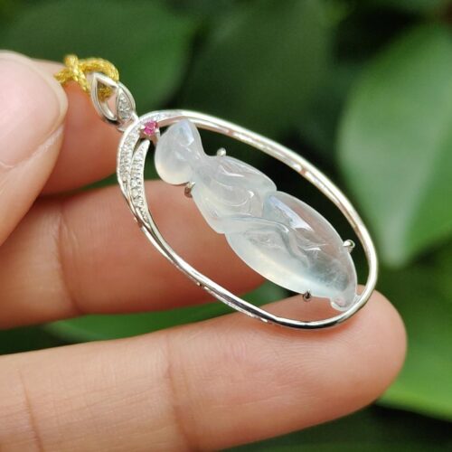 a hand holding a necklace