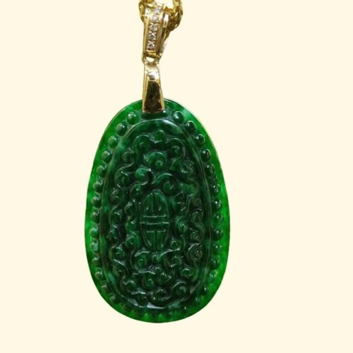 a green jade pendant with diamonds